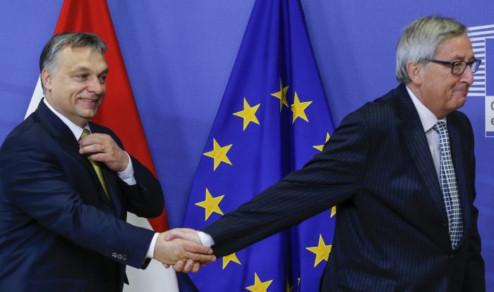European Commission President Jean claude Juncker (R) welcomes Hungarian Prime Minister Viktor Orban (L)